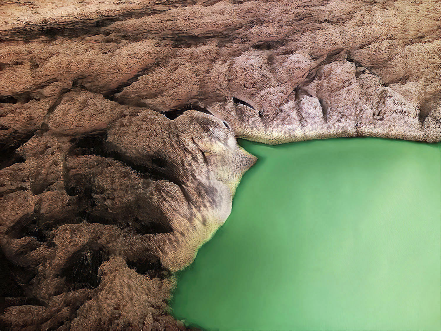 A computer generated image of a green pool of water surrounded by rocks.